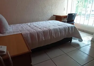 Cama o camas de una habitación en Hotel Malinalli Bella Vista