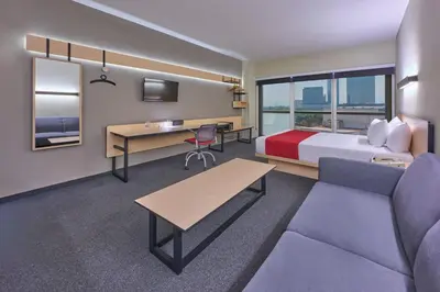 Cama o camas de una habitación en City Express Plus by Marriott Ciudad de México Patio Universidad