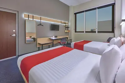 Cama o camas de una habitación en City Express Plus by Marriott Ciudad de México Patio Universidad