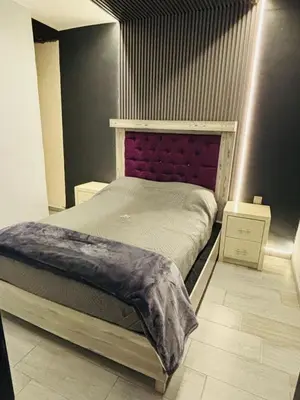 Cama o camas de una habitación en Depa Frente al aeropuerto hasta 12 Huéspedes