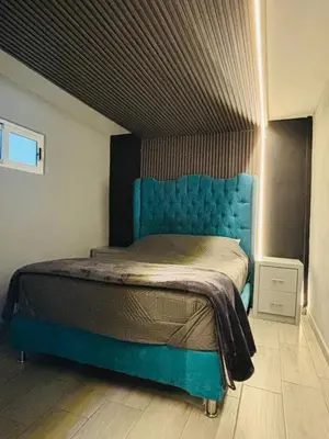 Cama o camas de una habitación en Depa Frente al aeropuerto hasta 12 Huéspedes