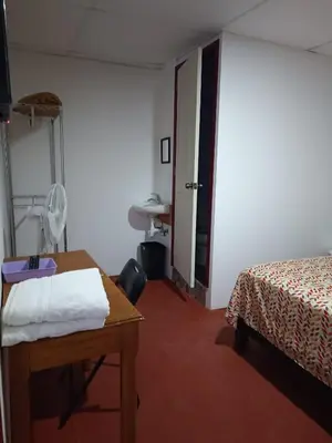 Cama o camas de una habitación en Hotel Posada Los Faroles Atlixco