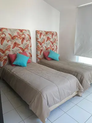 Cama o camas de una habitación en VILLA ACAPULCO DIAMANTE
