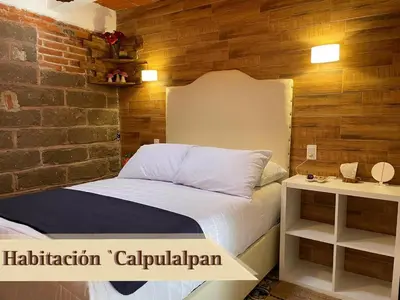 Cama o camas de una habitación en Hotel RioMiel Tlaxcala