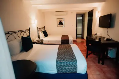 Cama o camas de una habitación en Hotel San Pedro Puebla