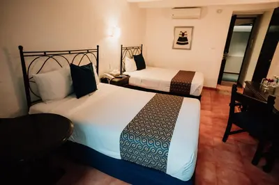 Cama o camas de una habitación en Hotel San Pedro Puebla