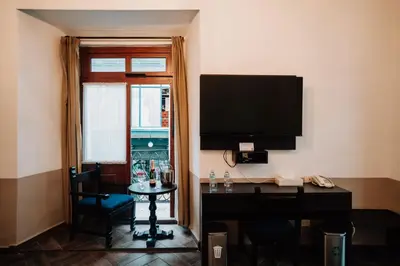 Una televisión o centro de entretenimiento en Hotel San Pedro Puebla