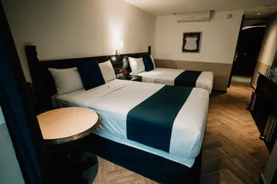 Cama o camas de una habitación en Hotel San Pedro Puebla