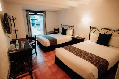 Cama o camas de una habitación en Hotel San Pedro Puebla