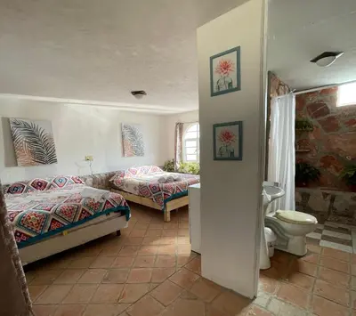Cama o camas de una habitación en Jardín Quinta Las Fuentes Cabañas, Valsequillo. PUEBLA