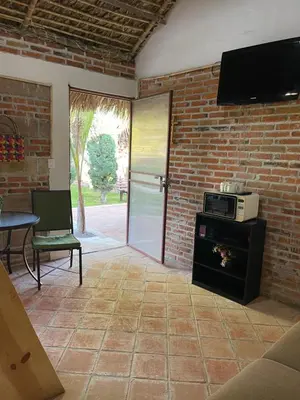 Una televisión o centro de entretenimiento en Jardín Quinta Las Fuentes Cabañas, Valsequillo. PUEBLA