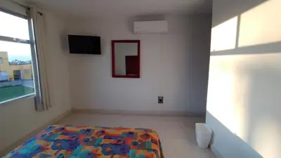 Cama o camas de una habitación en Hotel Villa Esmeralda