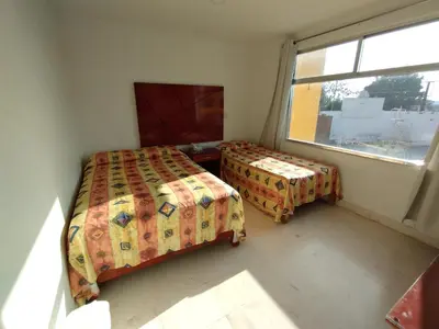 Cama o camas de una habitación en Hotel Villa Esmeralda