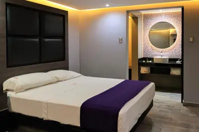 Cama o camas de una habitación en Auto-Hotel Playa Linda