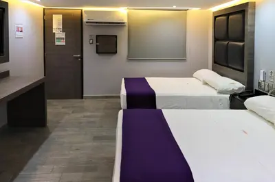 Cama o camas de una habitación en Auto-Hotel Playa Linda