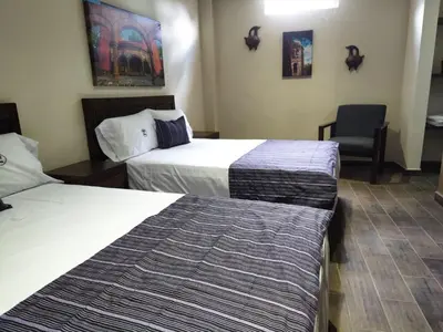 Cama o camas de una habitación en Hostería Tocali
