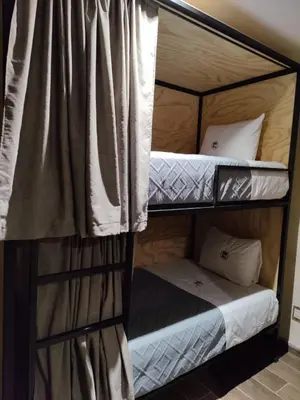 Cama o camas de una habitación en Hostería Tocali