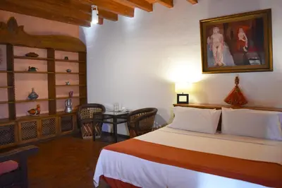 Cama o camas de una habitación en La Joyita Cuernavaca