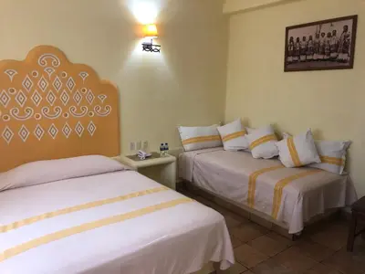 Cama o camas de una habitación en Hotel Maria Mixteca