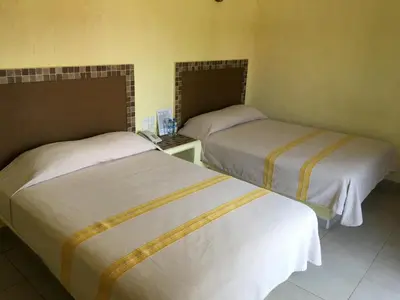 Cama o camas de una habitación en Hotel Maria Mixteca