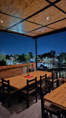 Un restaurante o sitio para comer en Hotel Casa Acueducto - Lujo Cultural