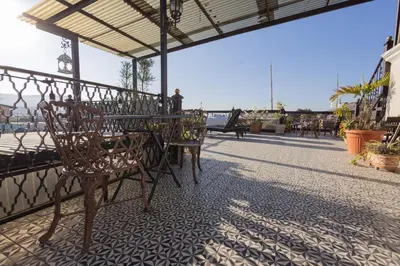 Un balcón o terraza de Capital O Hotel Patio Pombo