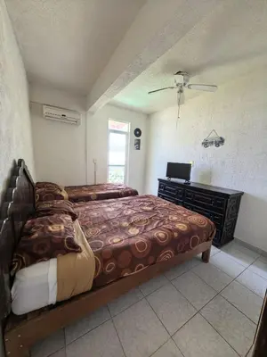 Cama o camas de una habitación en Bahía 50's