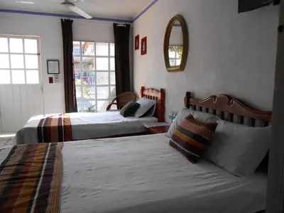 Cama o camas de una habitación en Hotel y Bungalows Monteverde
