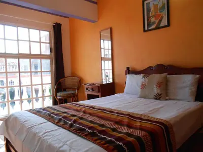 Cama o camas de una habitación en Hotel y Bungalows Monteverde