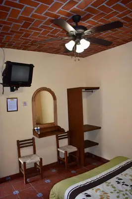 Una televisión o centro de entretenimiento en Posada Rincon Magico