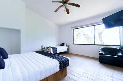 Cama o camas de una habitación en Cotlamani Hotel Aventura