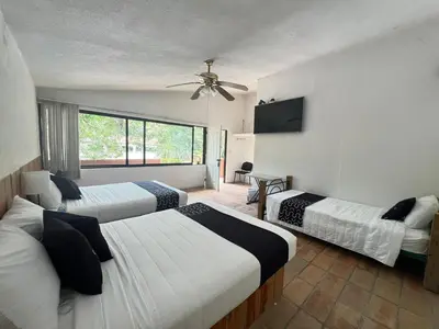 Cama o camas de una habitación en Cotlamani Hotel Aventura