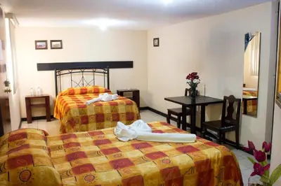 Cama o camas de una habitación en Villas Hotel Cholula