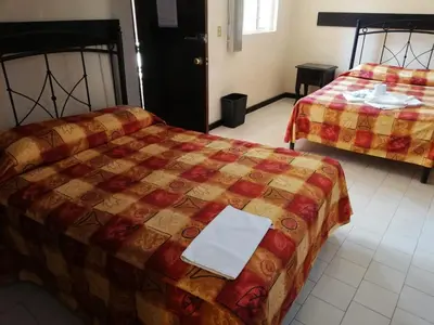 Cama o camas de una habitación en Villas Hotel Cholula