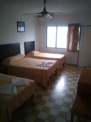 Cama o camas de una habitación en HOTEL ACUARIO CATEMACO
