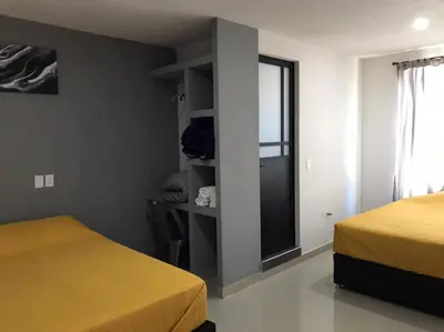 Cama o camas de una habitación en HOTEL NUEVA LUNA