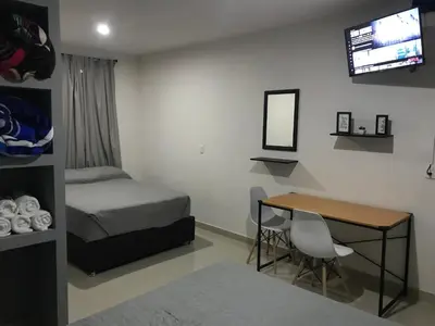 Cama o camas de una habitación en HOTEL NUEVA LUNA