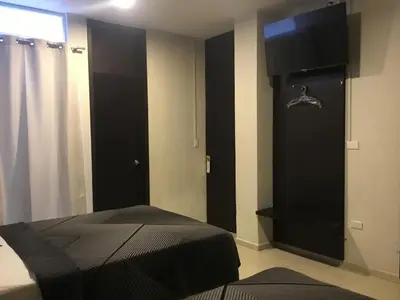 Una televisión o centro de entretenimiento en Hotel Tao