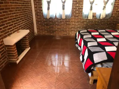 Cama o camas de una habitación en Cabañas El Manantial