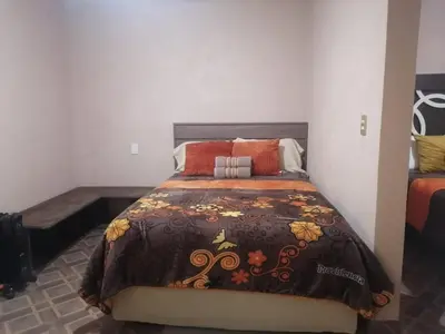 Cama o camas de una habitación en La casa de las flores