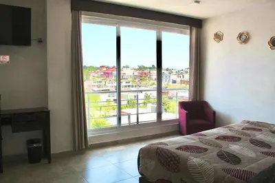 Cama o camas de una habitación en Hotel ESTRELLA