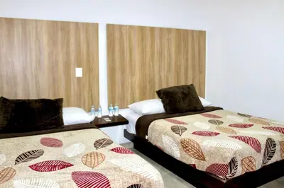 Cama o camas de una habitación en Hotel ESTRELLA