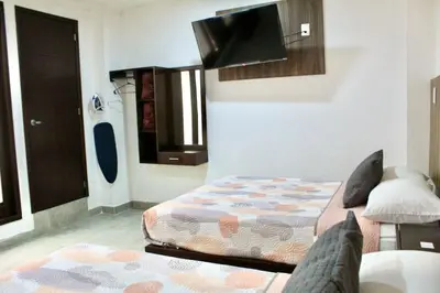 Cama o camas de una habitación en Hotel ESTRELLA