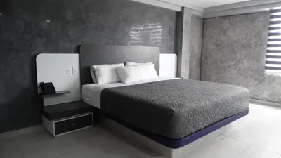 Cama o camas de una habitación en MOTEL & HOTEL ALJIBE