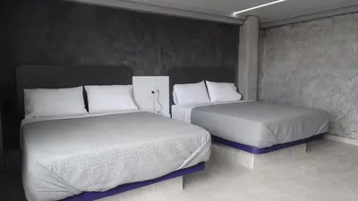 Cama o camas de una habitación en MOTEL & HOTEL ALJIBE