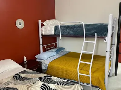 Cama o camas de una habitación en Sensity Home Preciosa y espaciosa casa todos los servicios 5 min del CIS