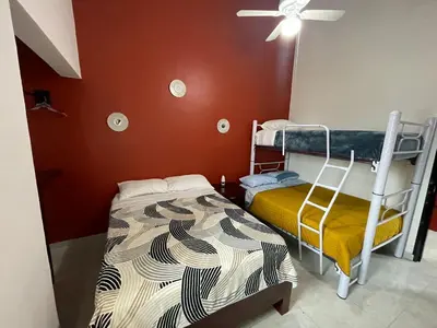 Cama o camas de una habitación en Sensity Home Preciosa y espaciosa casa todos los servicios 5 min del CIS