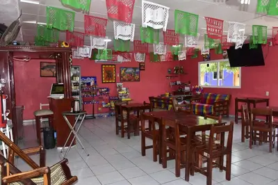 Una televisión o centro de entretenimiento en Hotel Bacaanda