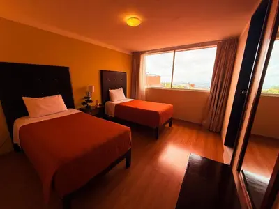 Cama o camas de una habitación en Hotel Suites Teziutlan