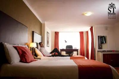 Cama o camas de una habitación en Hotel Suites Teziutlan